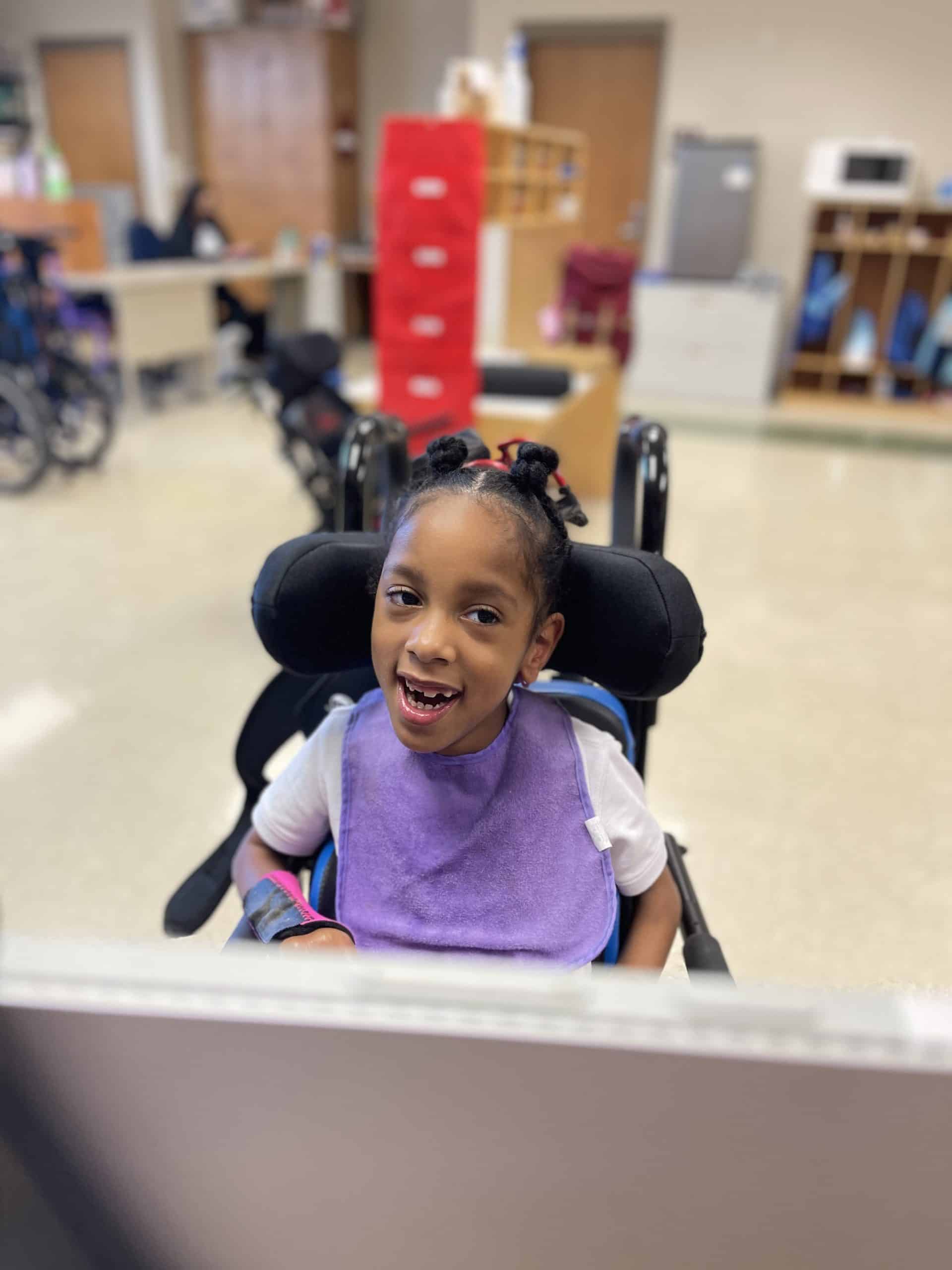 young female African American student in a wheelchair