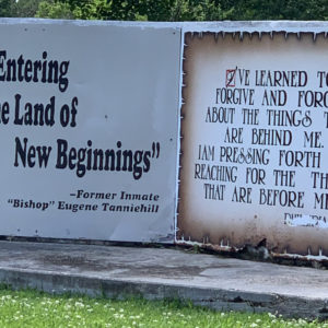 Stone monument says "You are entering into the land of new beginnings