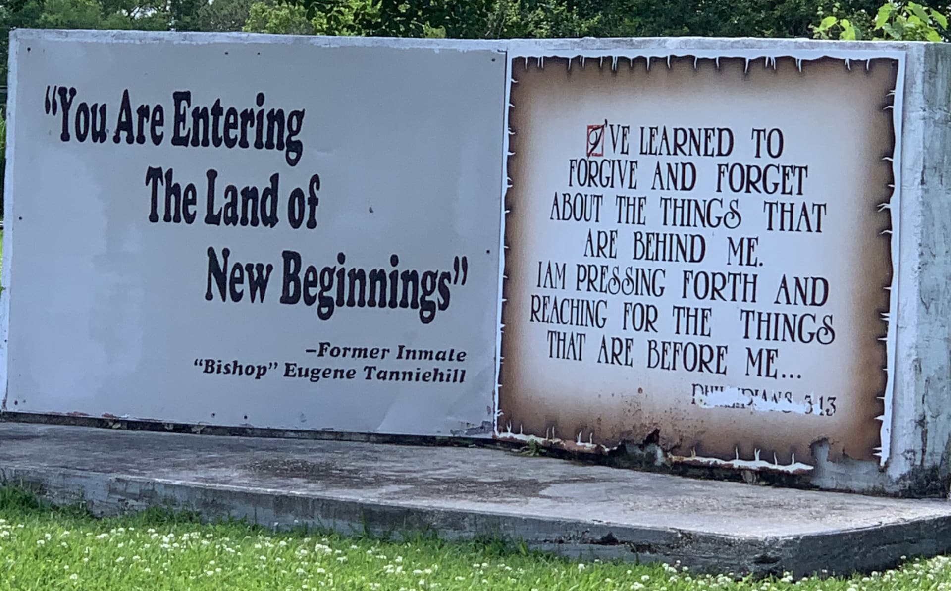 Stone monument says "You are entering into the land of new beginnings